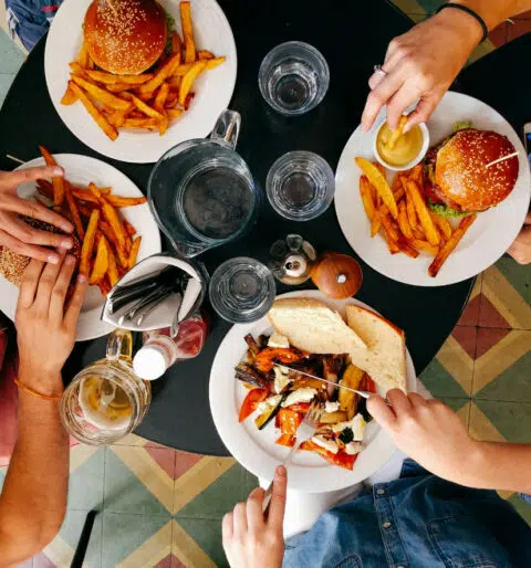 Friends sharing a meal at a nearby restaurant